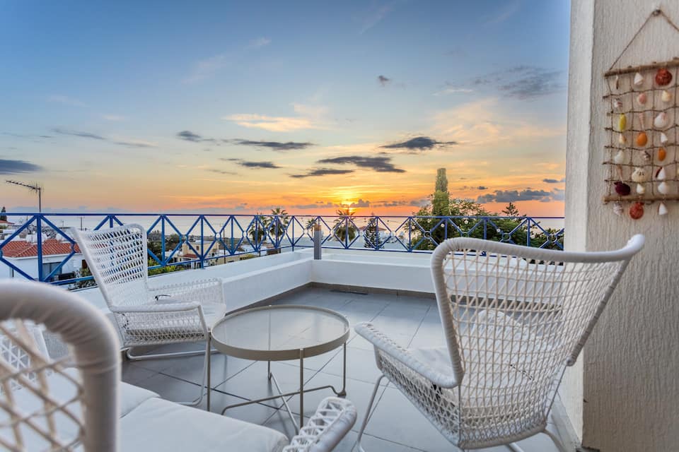 Sunset over the sea from the terrace of Sunset Kiss in Kissonerga